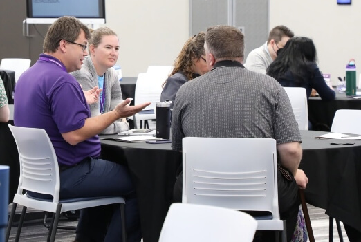 Our web design support specialist discussing web accessibility with other attendees at TechAccess Oklahoma